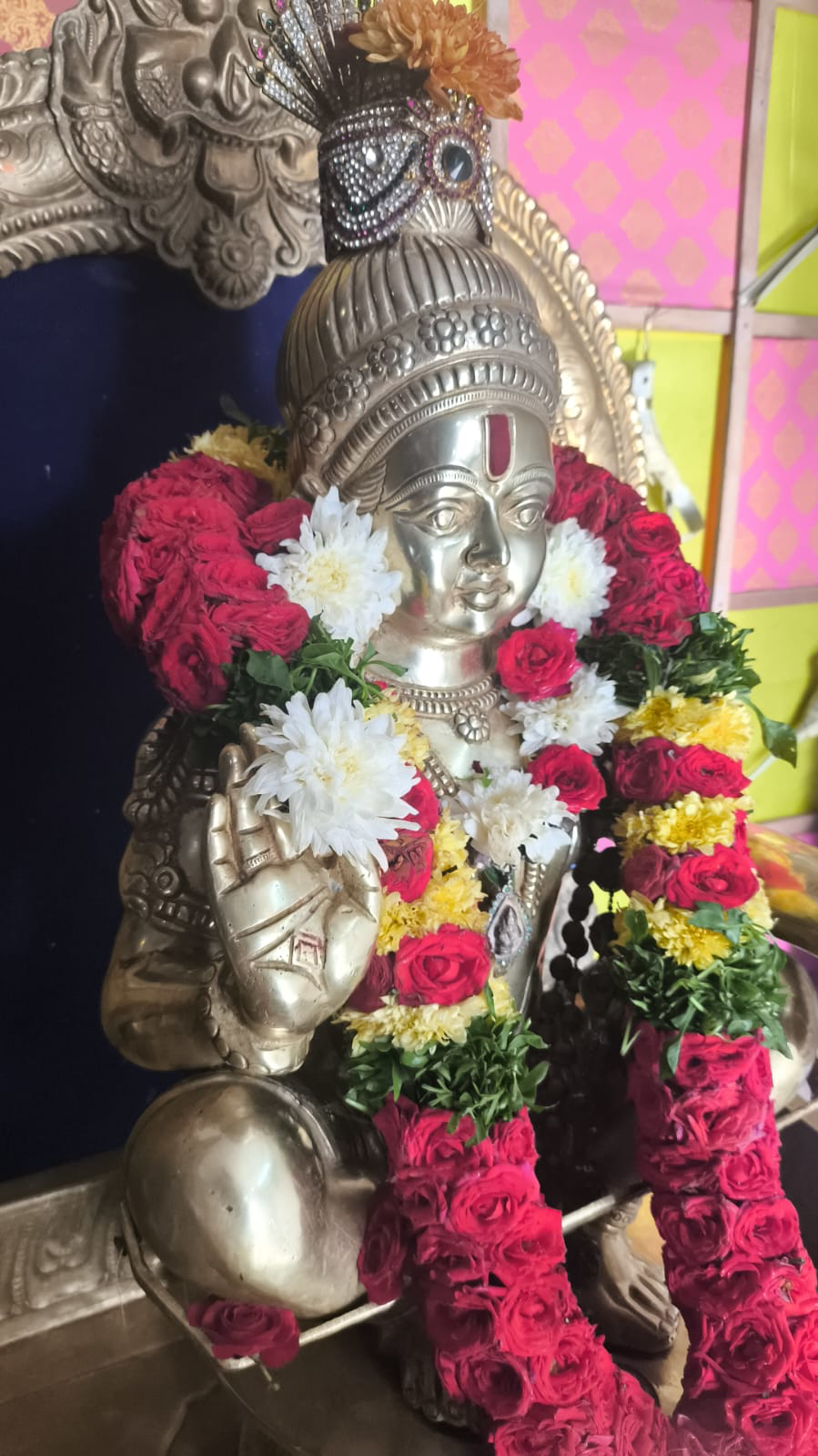 Lord Ayyappa Swamy idol adorned with flowers