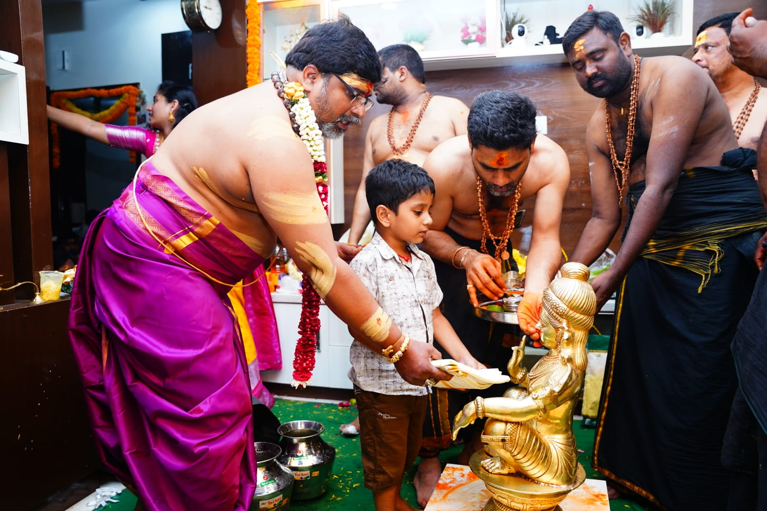 Devotees performing Abhishekam pooja